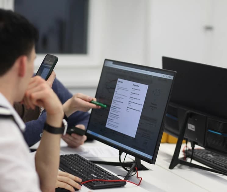 Team members reviewing systems and reporting workflow